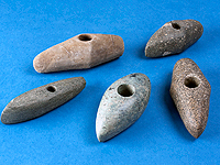 Kamenné sekeromlaty kultury se šňůrovou keramikou z hrobů z Nových Butovic
